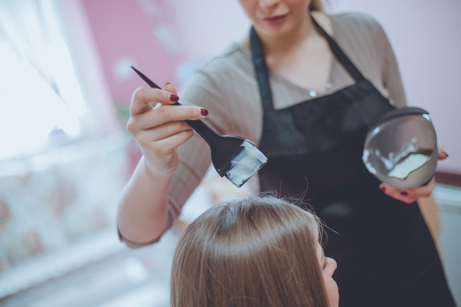 Choose the right color. Woman at the hairdresser. Close up. Hair coloring.