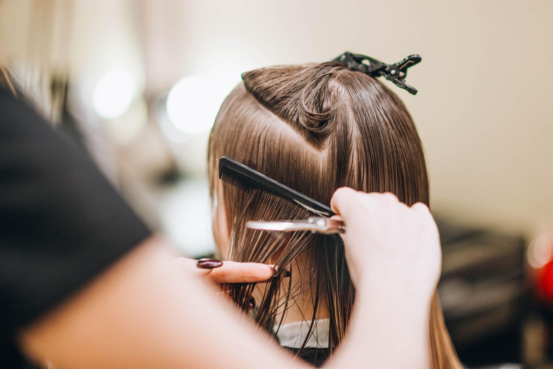 work of a hairdresser in styling and cutting hair.